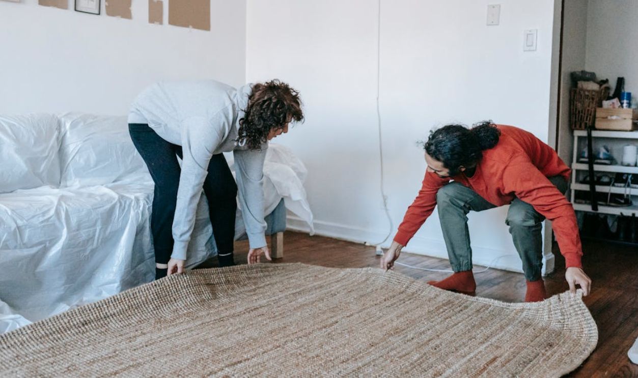 Couple Moving Out A Carpet