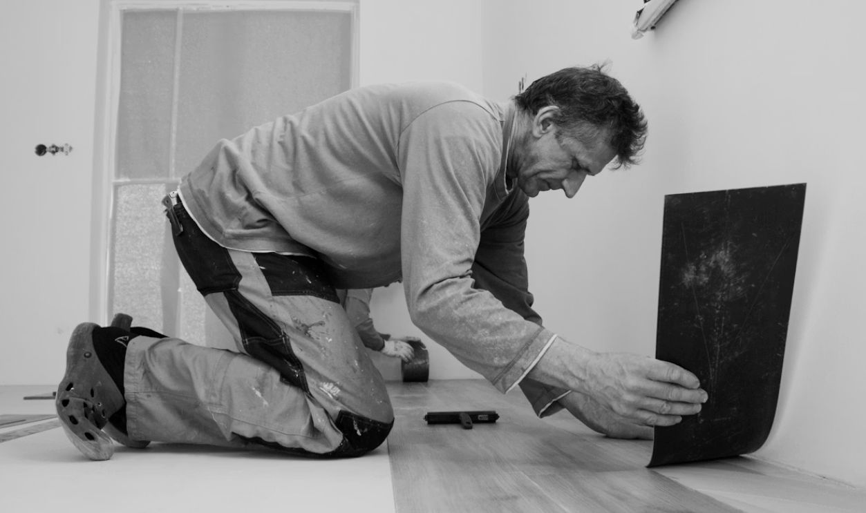A man laying on the floor in a room