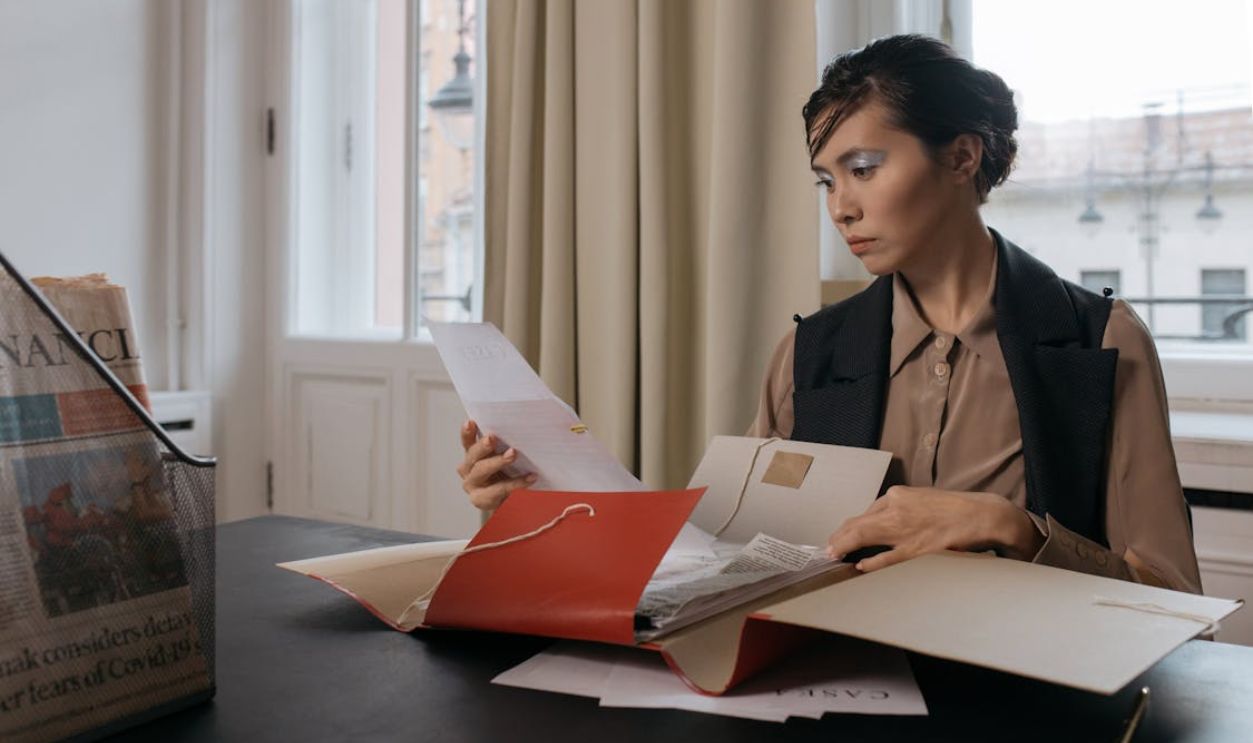 A Woman Holding Documents