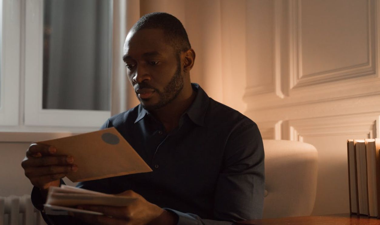 Man Reading Letters
