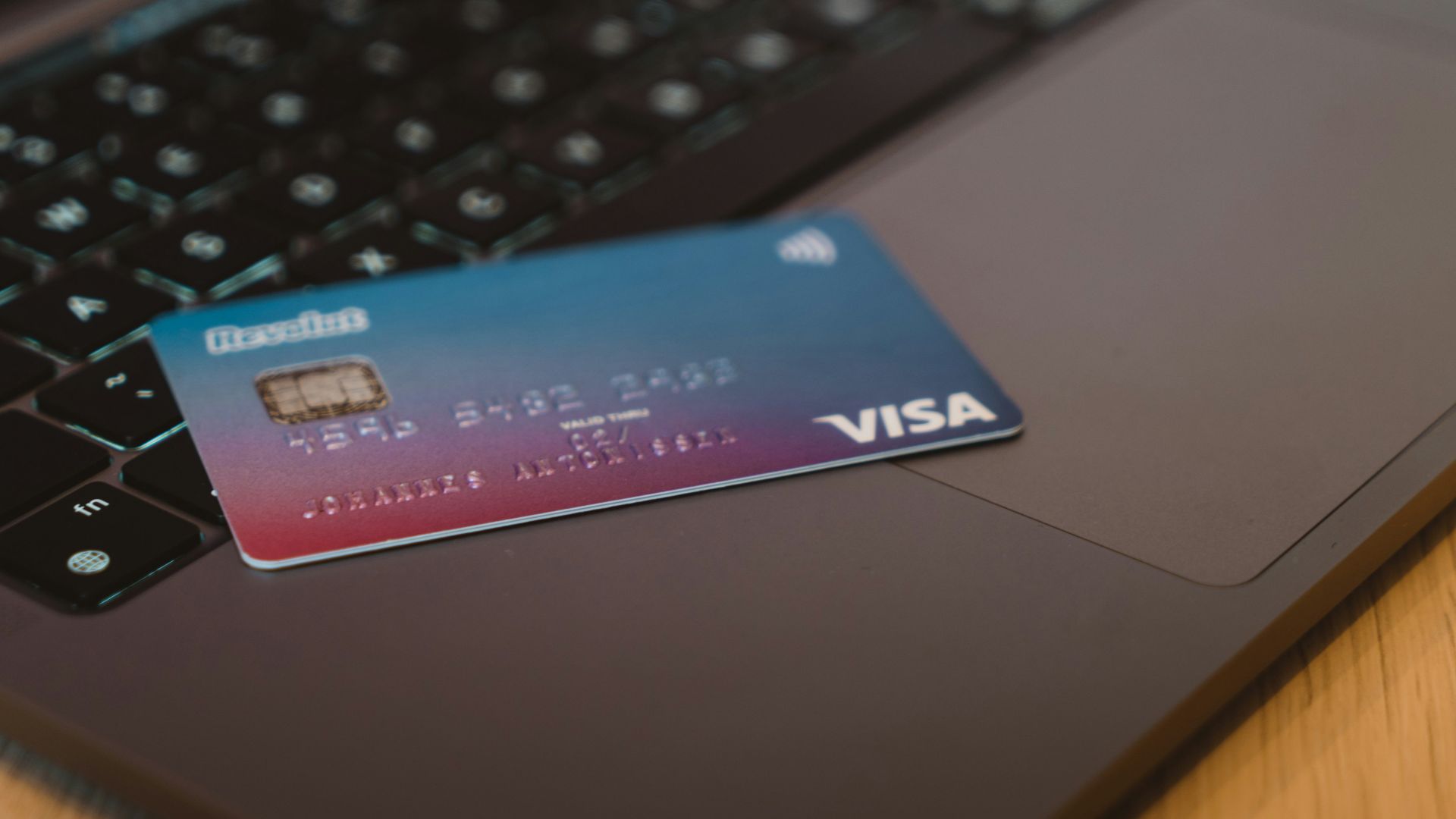 blue and white visa card on silver laptop computer