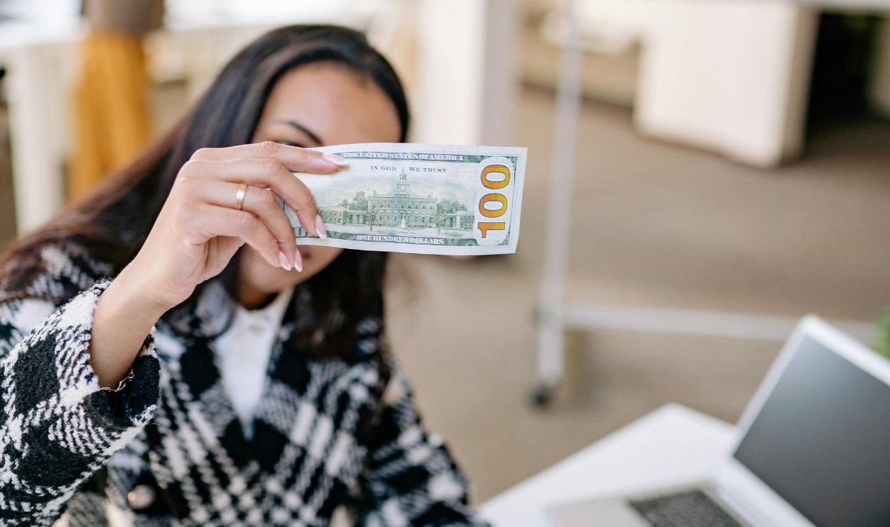 Selective Focus of a Woman Holding Paper Money