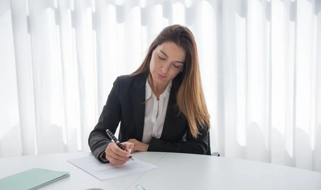 Businesswoman Signing Document
