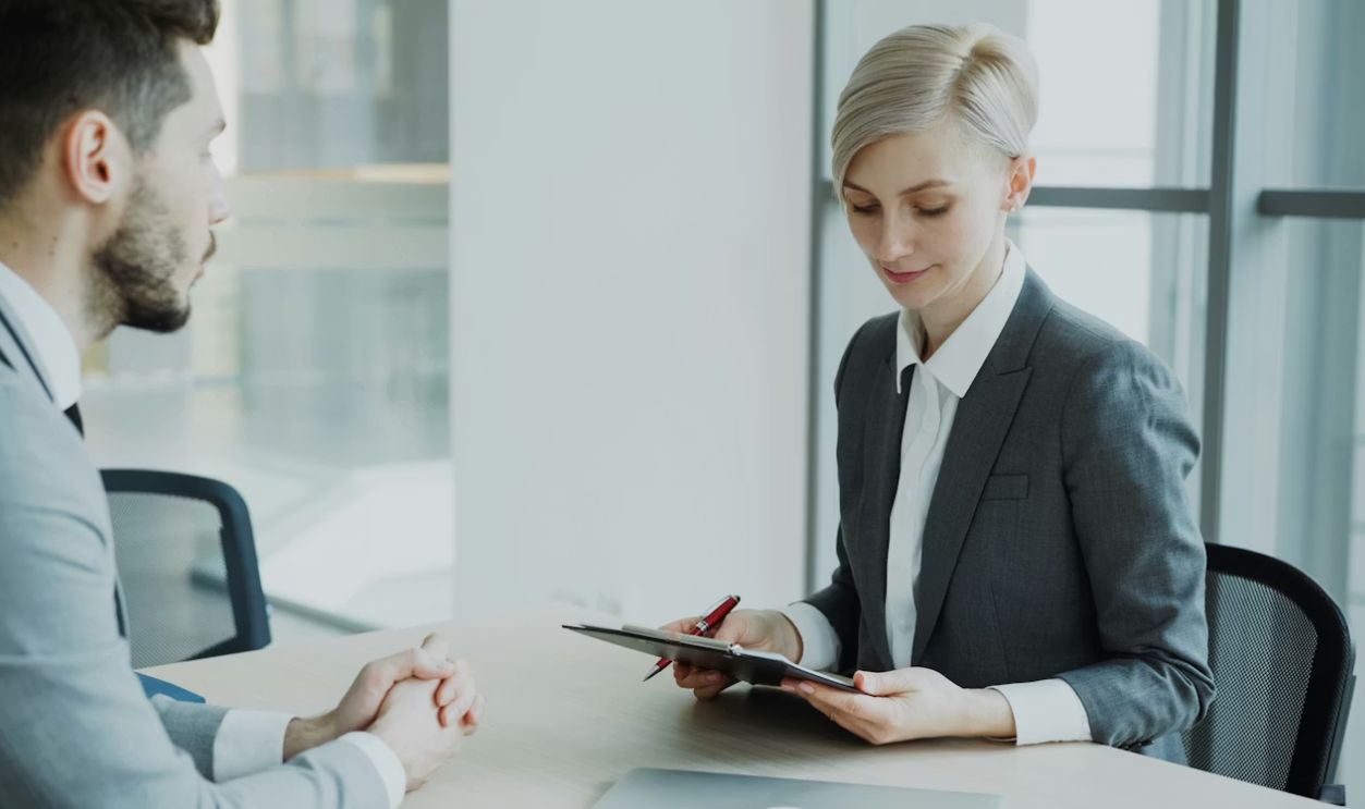 Person Reviewing Forms in a Foreign Bank Branch