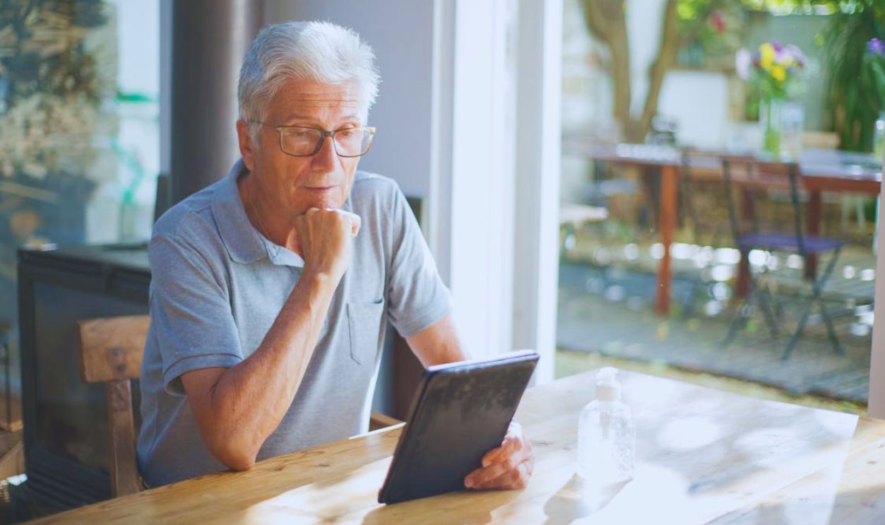 Elderly Man Using a Tablet