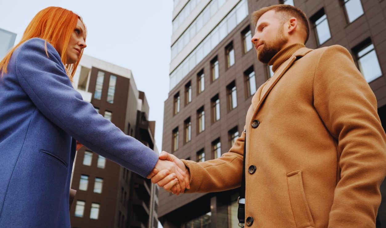Man and Woman Shaking Hands