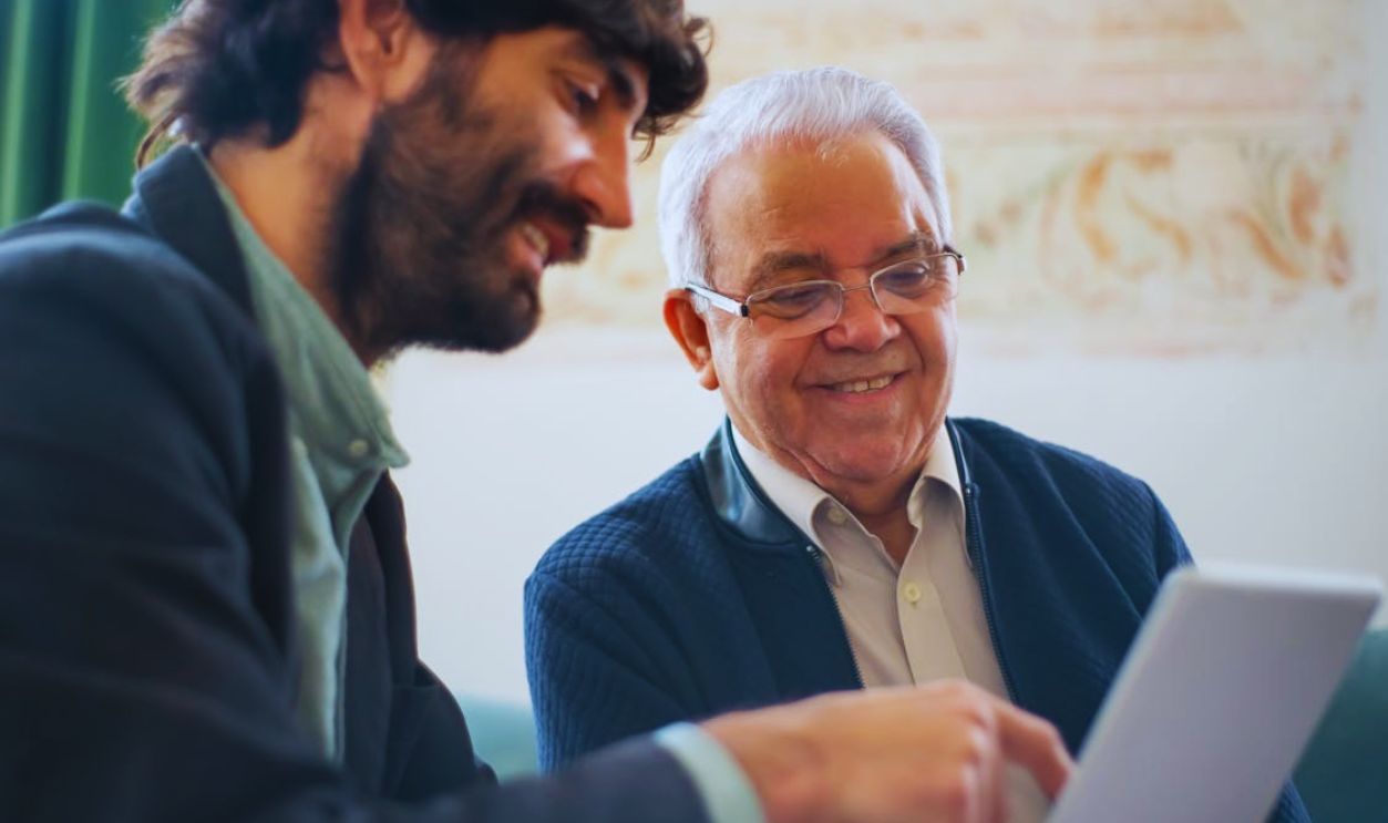 Men Looking at a Laptop