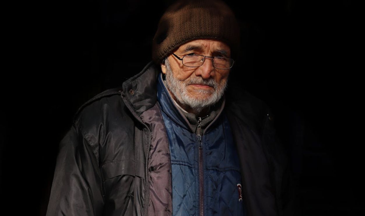 A Beaded Man in Black Jacket