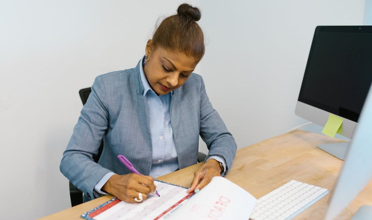Woman Marking Her Calendar