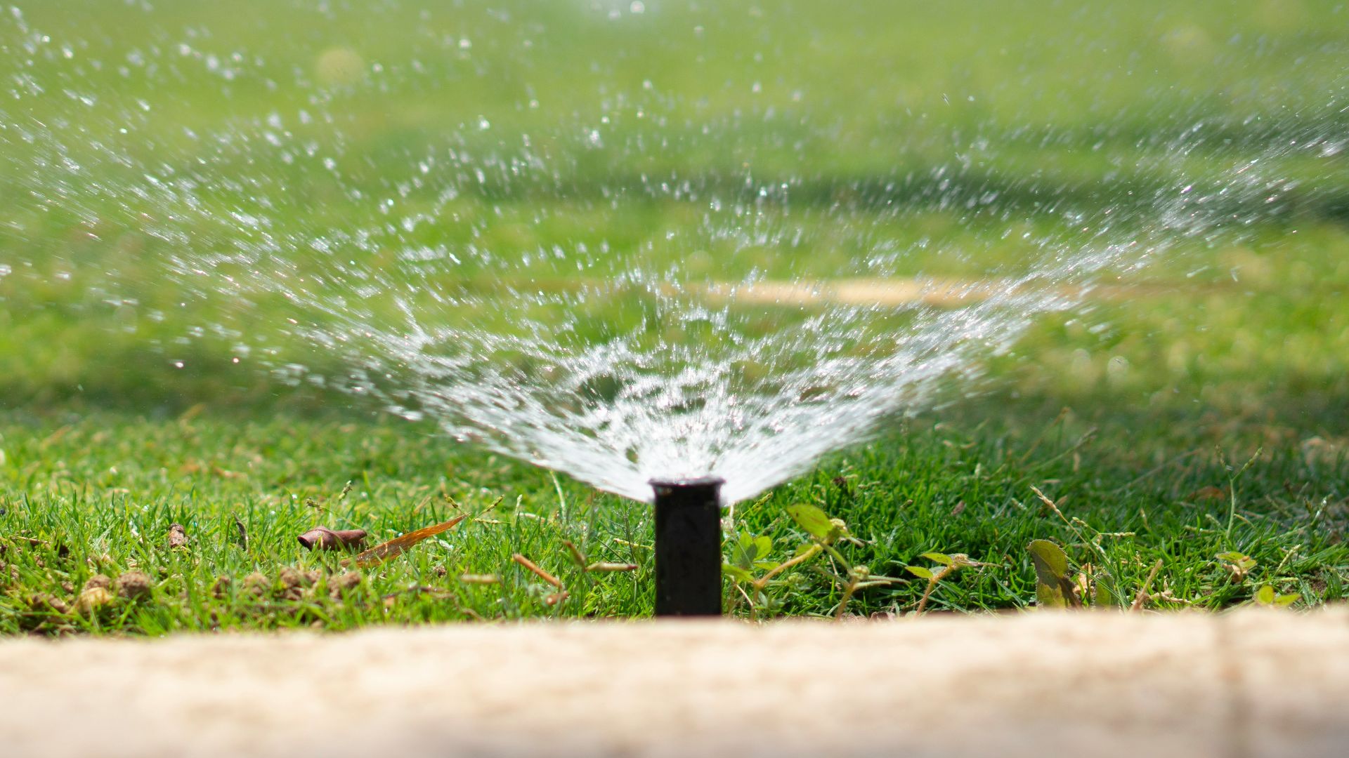 water splash on brown wooden post