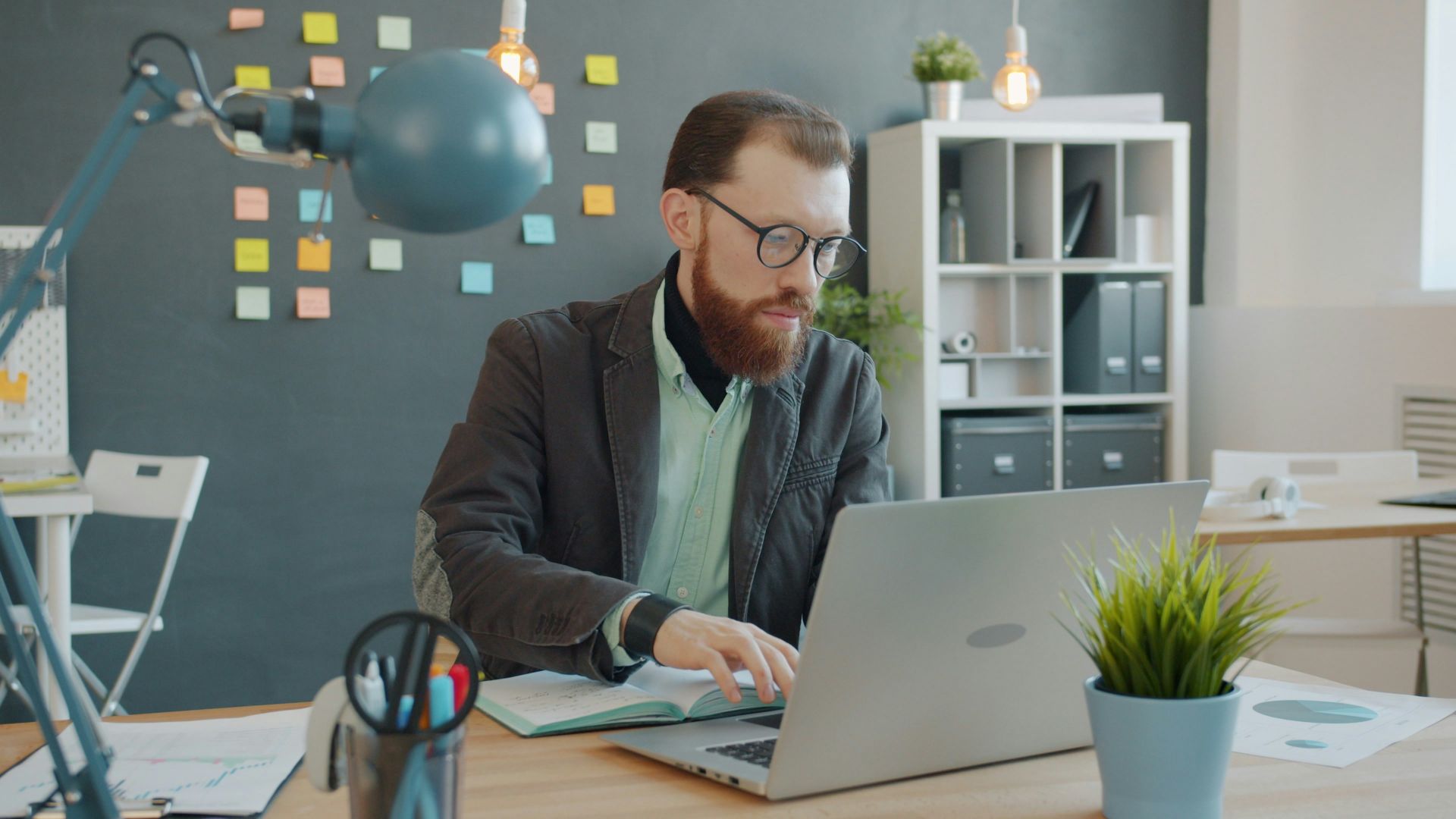 Man working on laptop in modern office