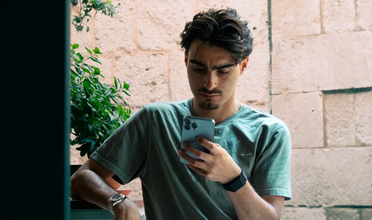 A person urgently checking their phone