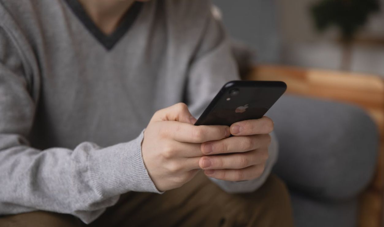 Photo Of Man Using Smartphone
