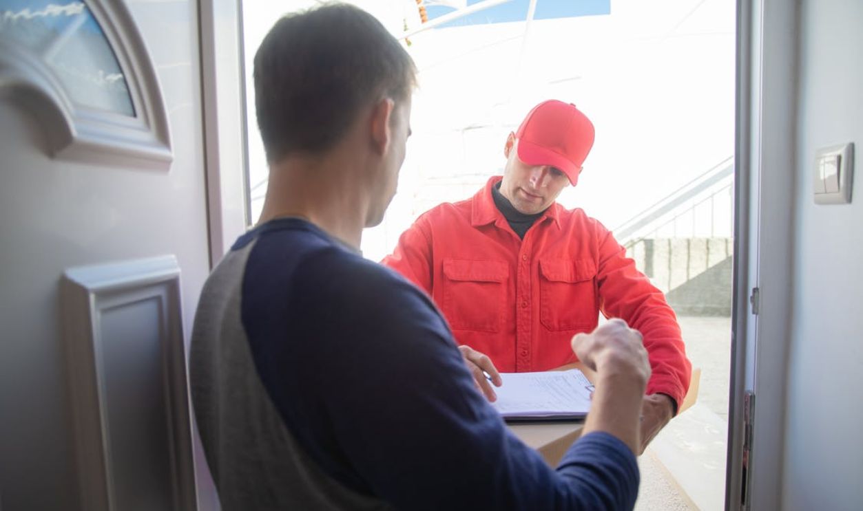 A Man Receiving a Package