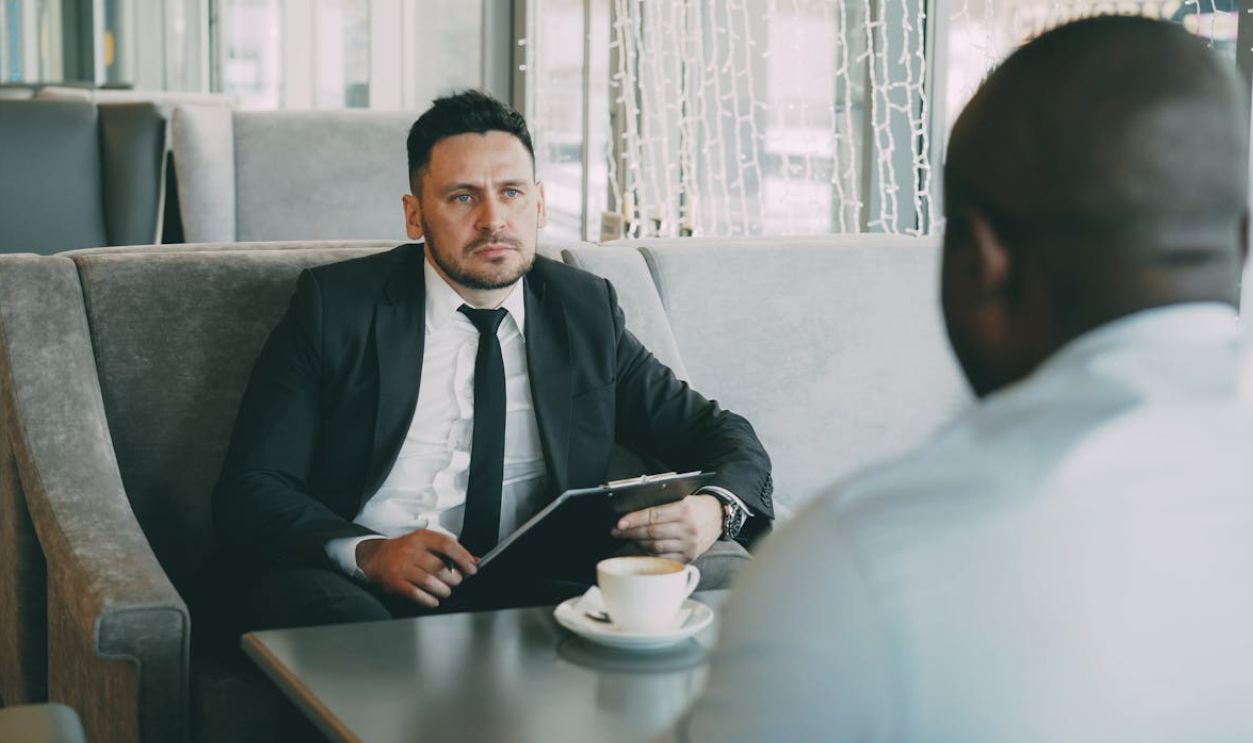customer speaking with bank staff in discussion