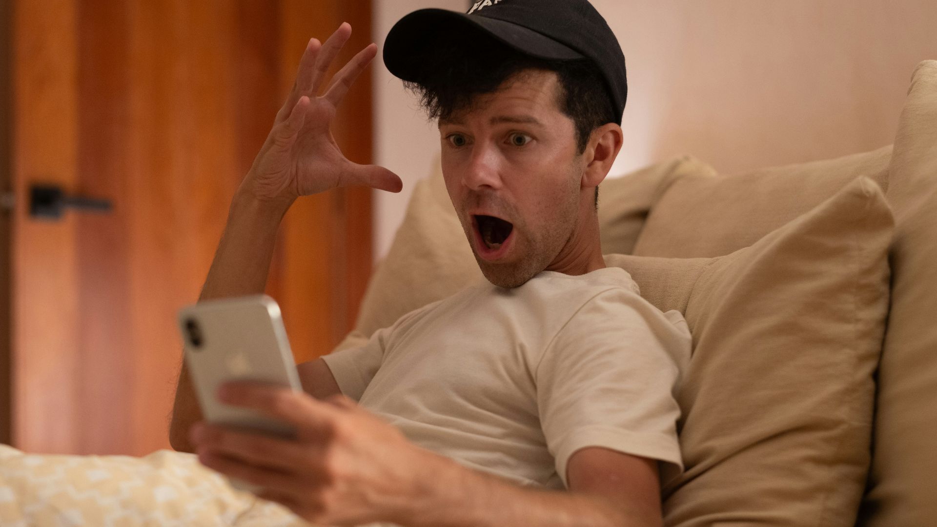 The man is shocked by his phone.