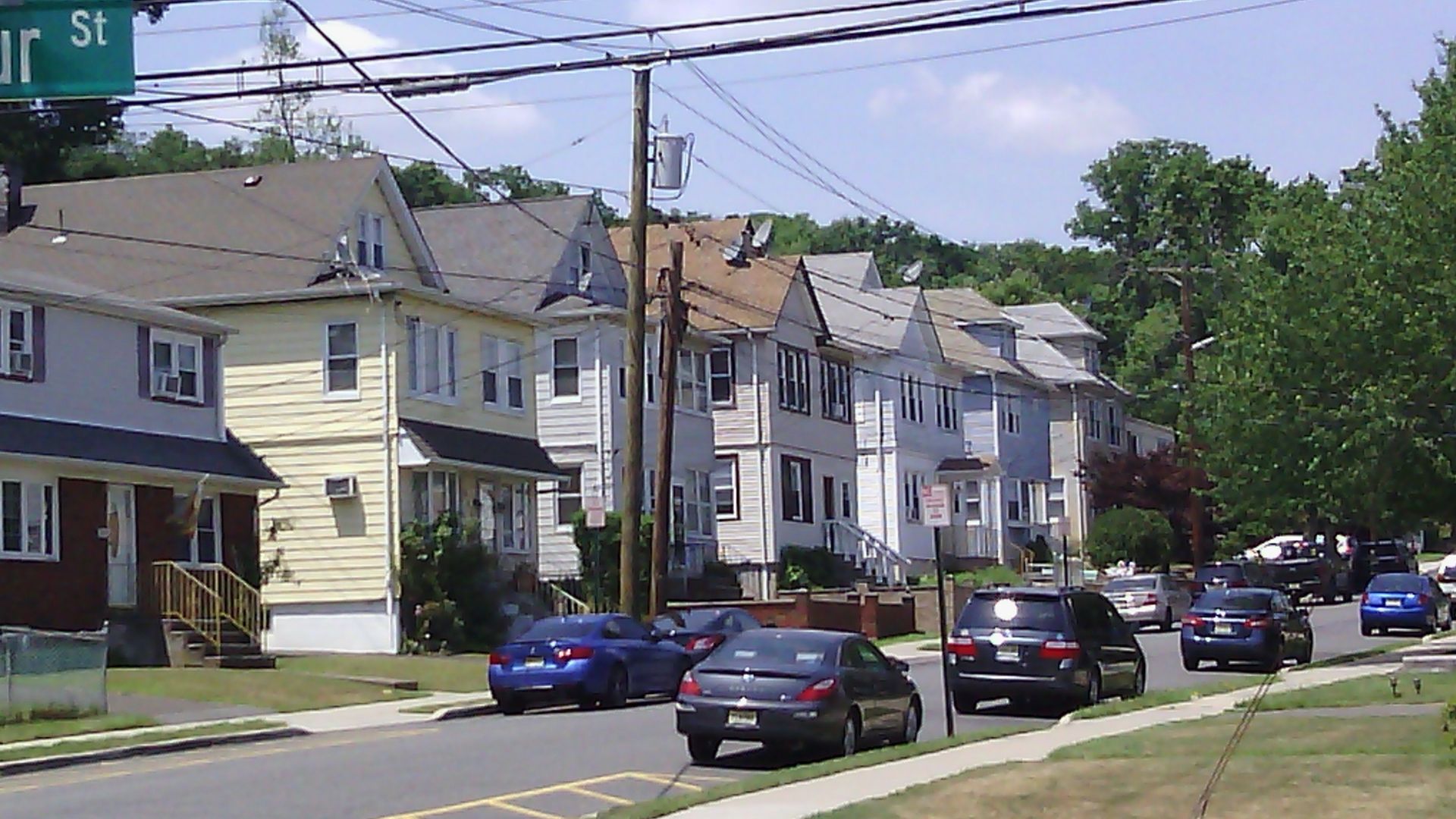 Southside Avenue, viewed from Barbour Street, in Haledon, N.J.  View shows a number of two-family, two-story wood houses typical of northeastern US.