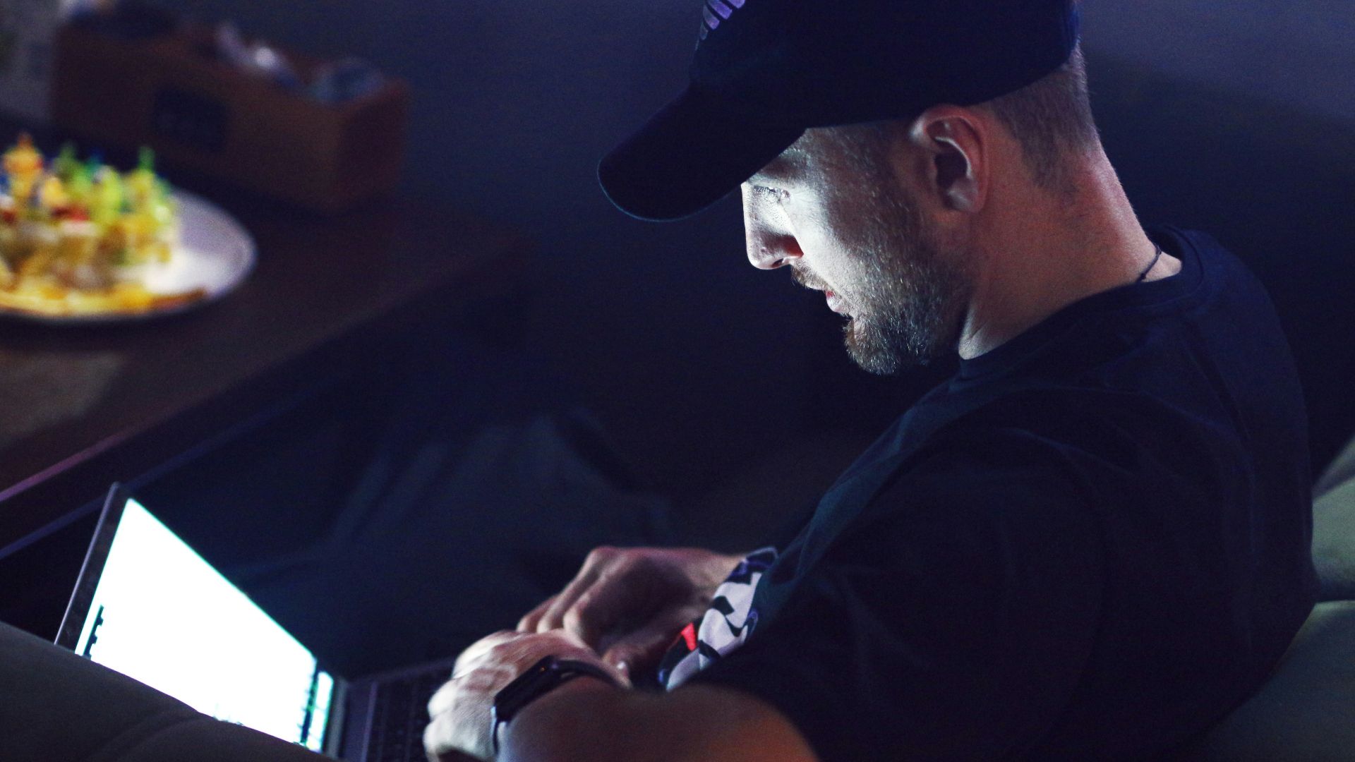 a man sitting in front of a computer