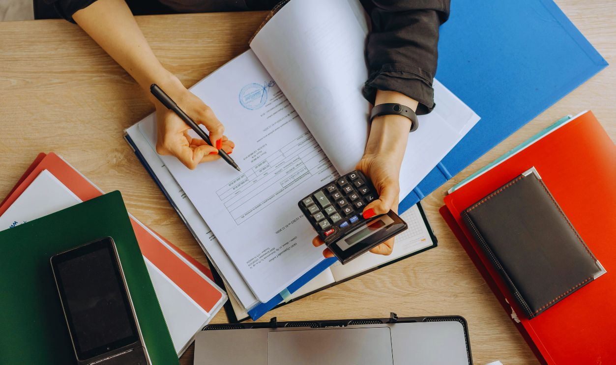 A Person Examining Documents