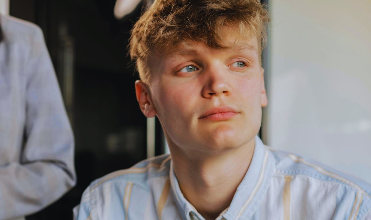 Photo of a Man with Blond Hair Holding a Marker