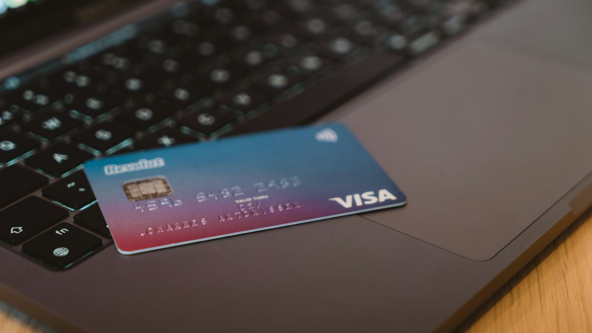 blue and white visa card on silver laptop computer