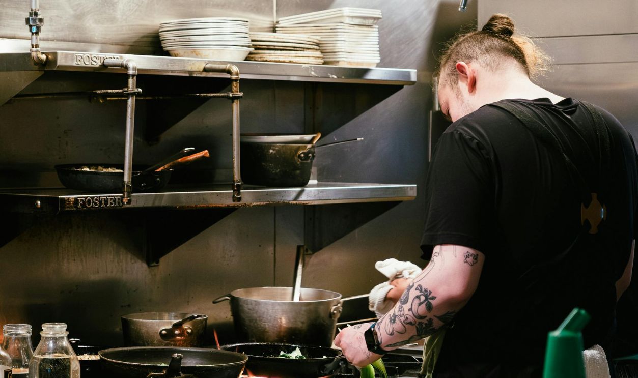 Busy Chef Cooking in a Professional Kitchen