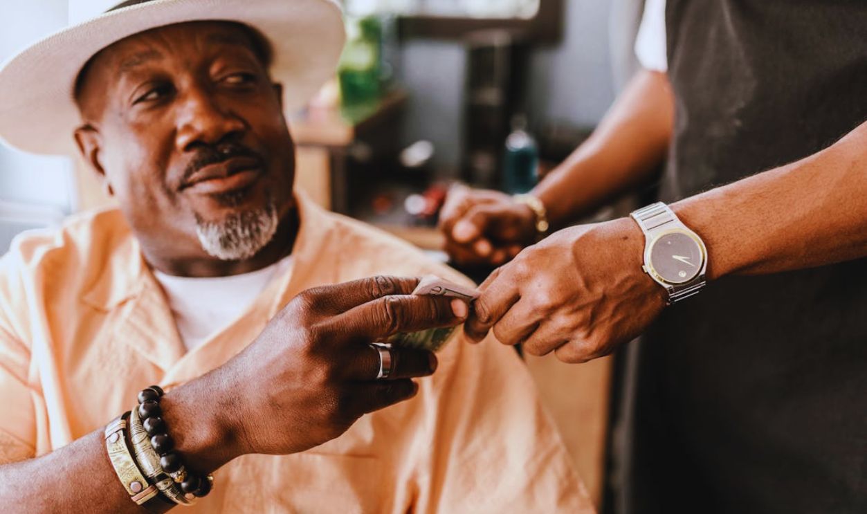 Close up of Man Giving Money