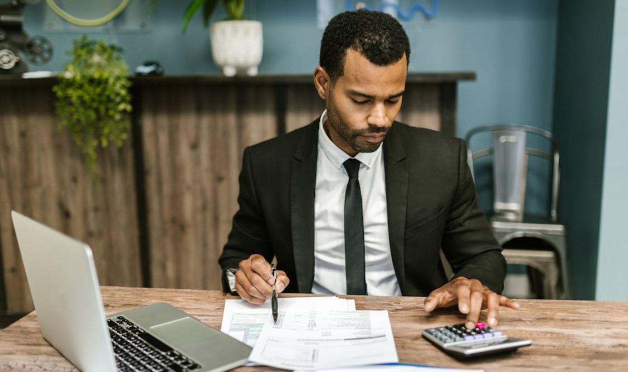 Man in Black Suit Working