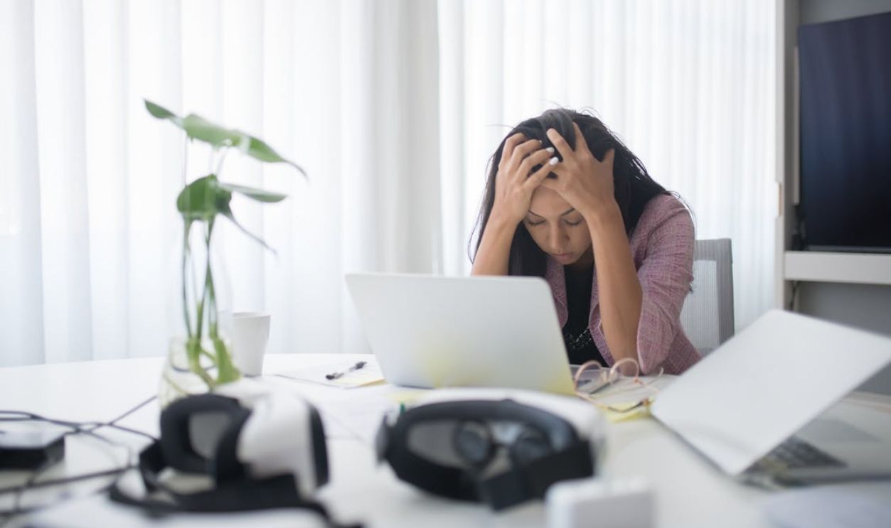 Photo of a Stressed Woman at Work
