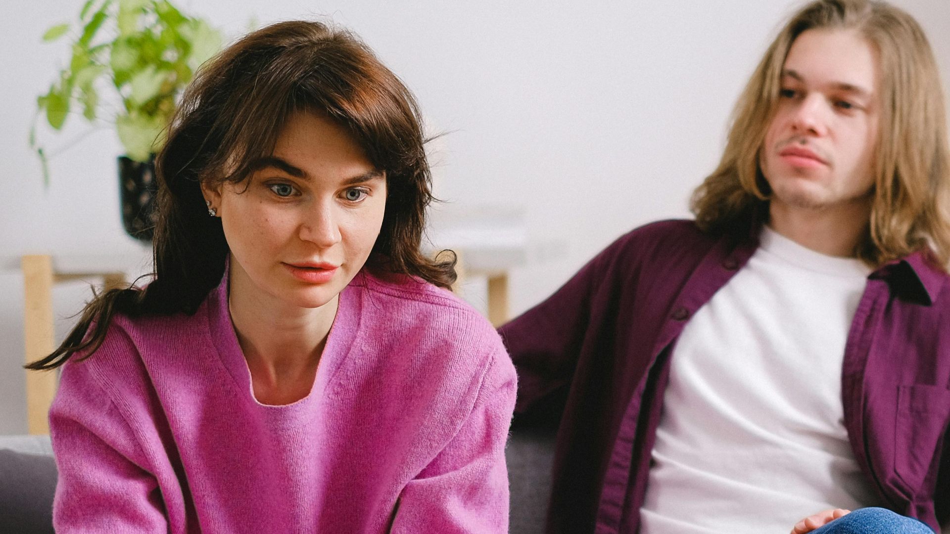 A couple engaging in a professional therapy session, seeking guidance.