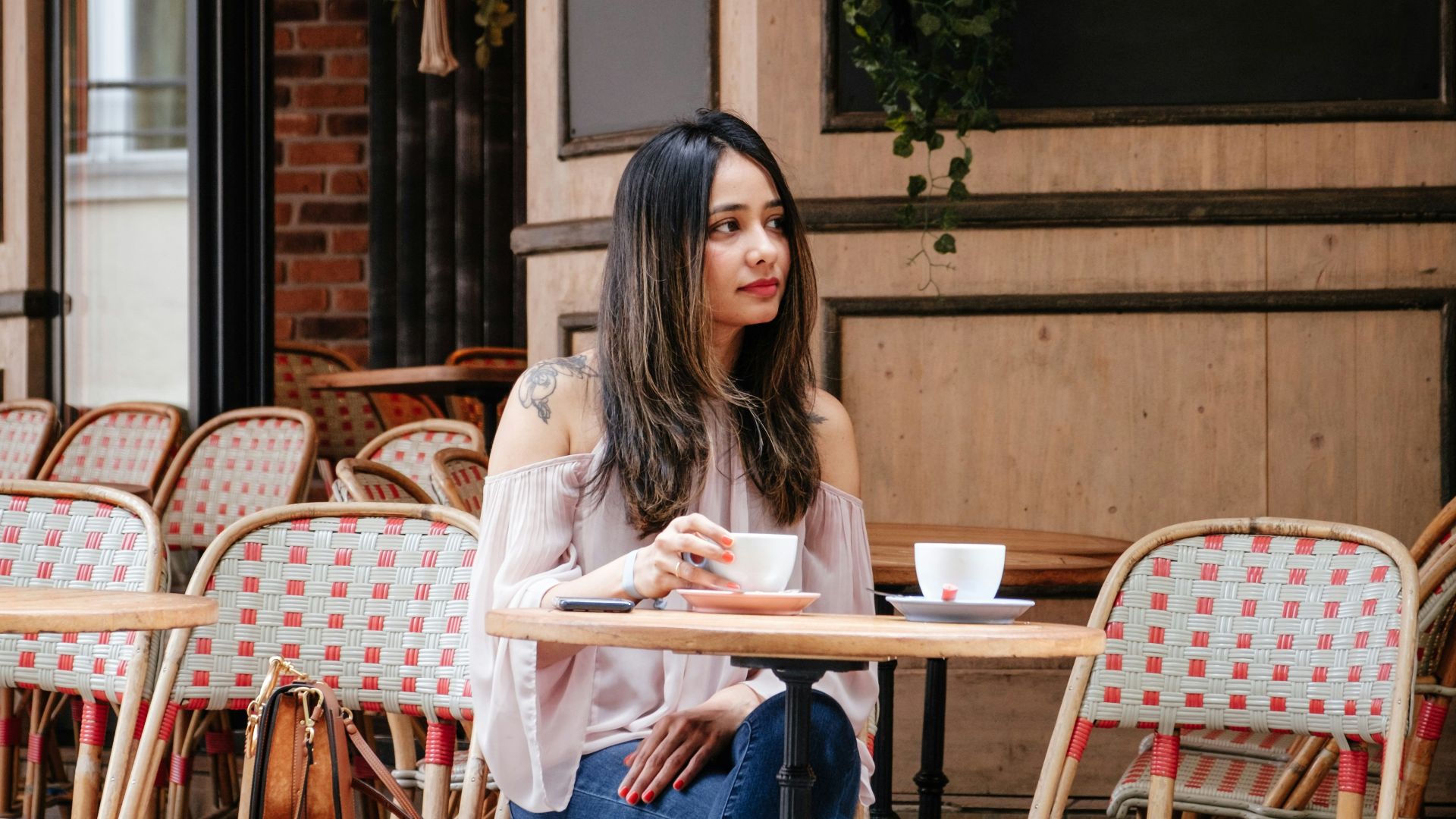 woman sitting on chair beside table
