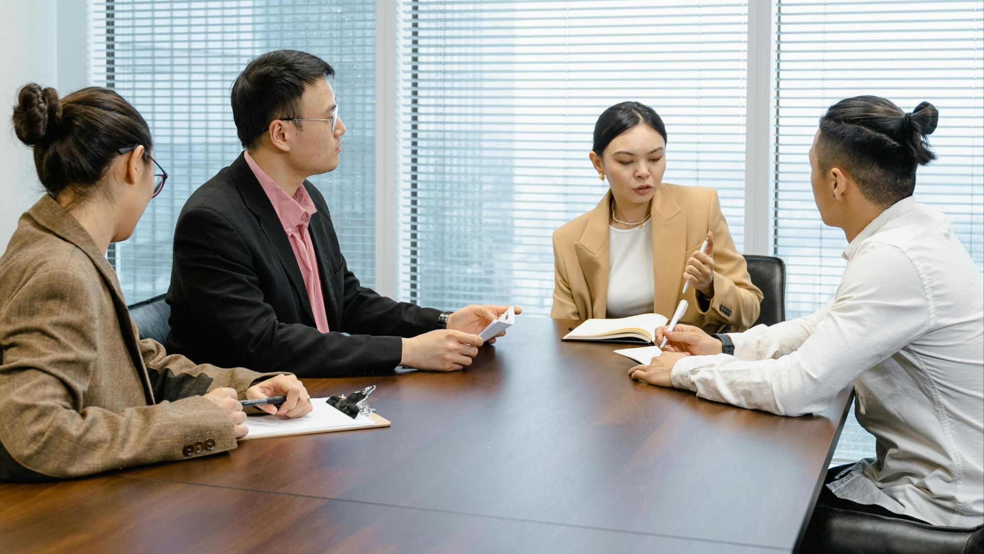 Group of colleagues collaborating in a modern office setting.
