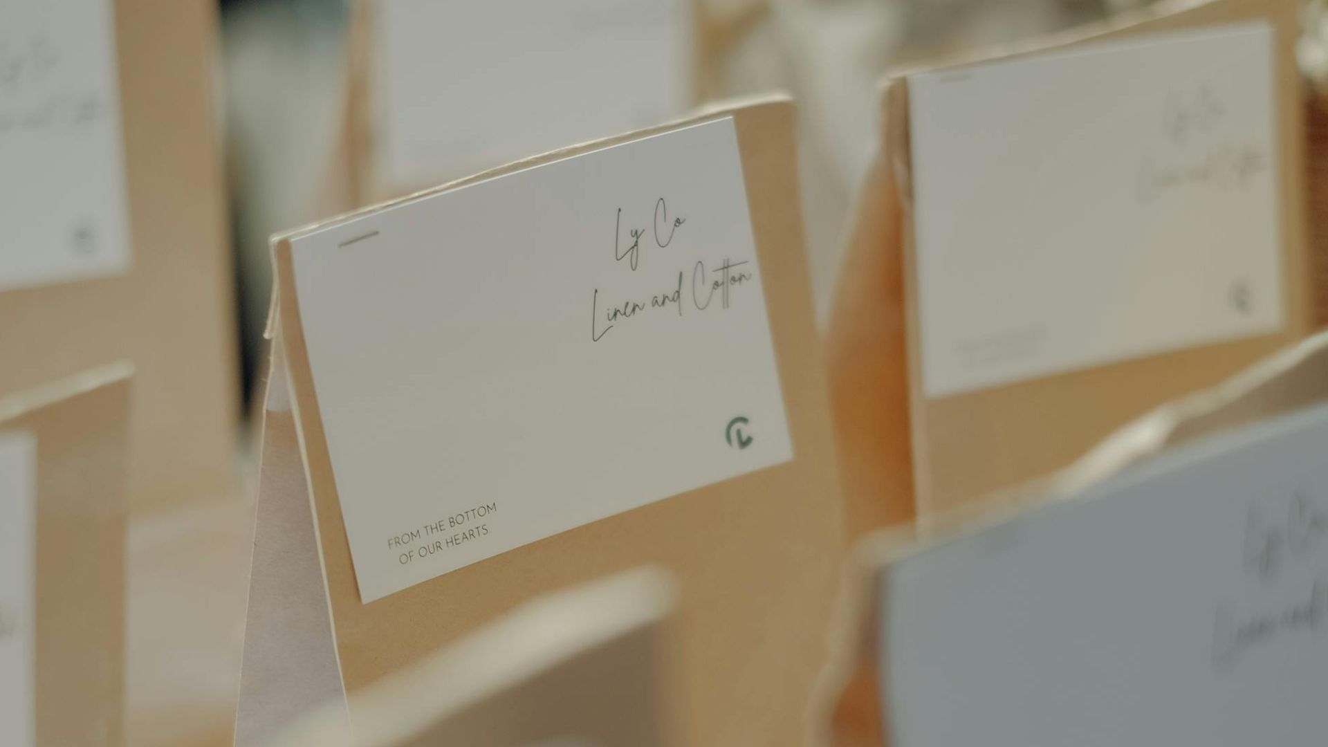 Labeled brown paper bags arranged in rows for a gift event or workshop.