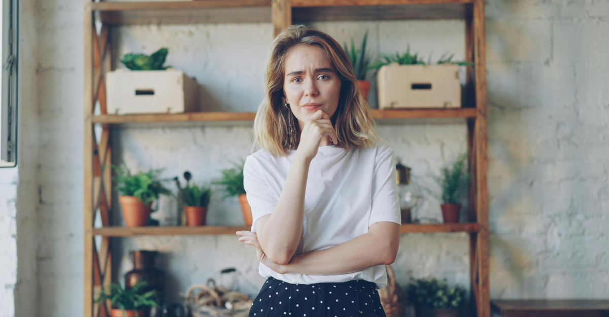 pensive-woman-posing-in-plant-filled-room