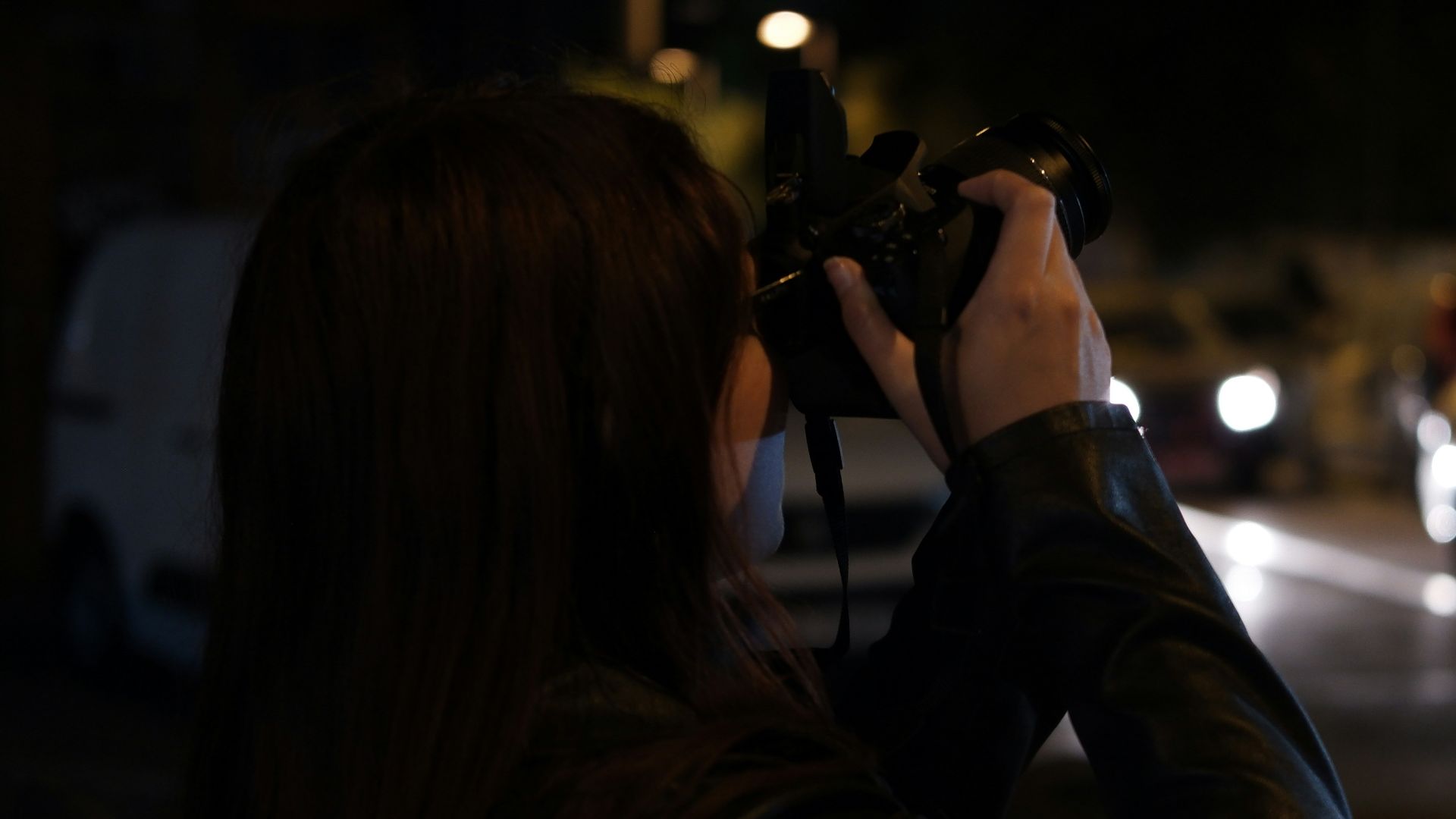 A woman taking a picture of a group of people
