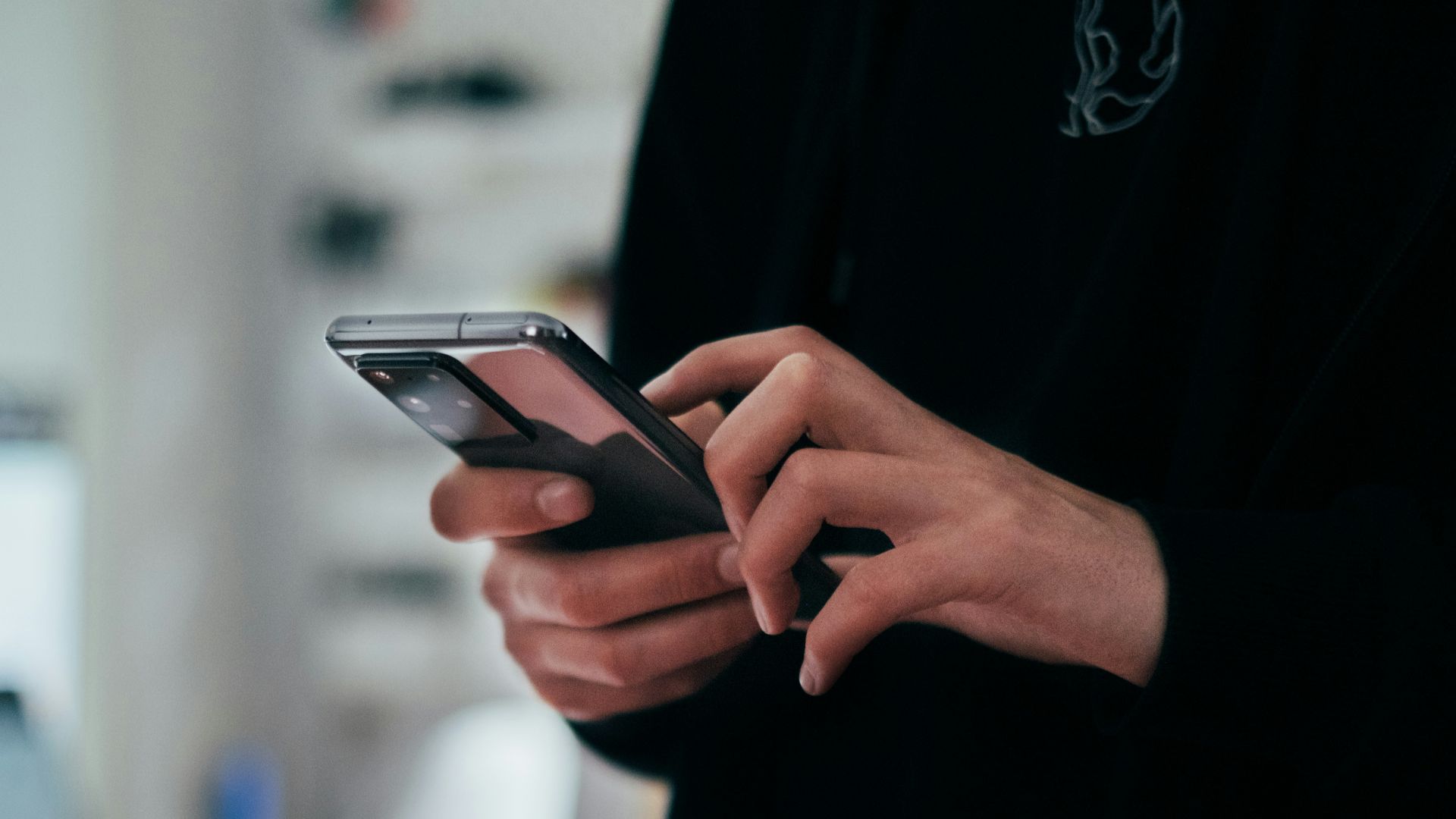 person holding black android smartphone