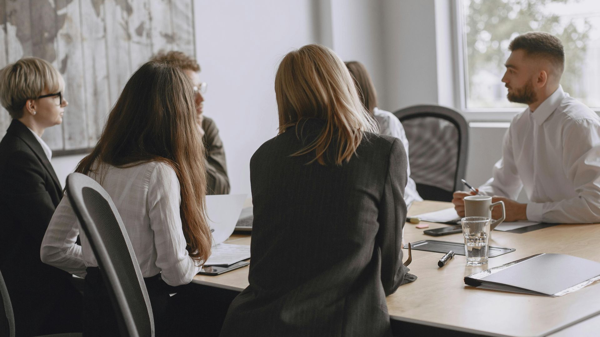 Colleagues in a productive meeting at a modern office, fostering teamwork and collaboration.