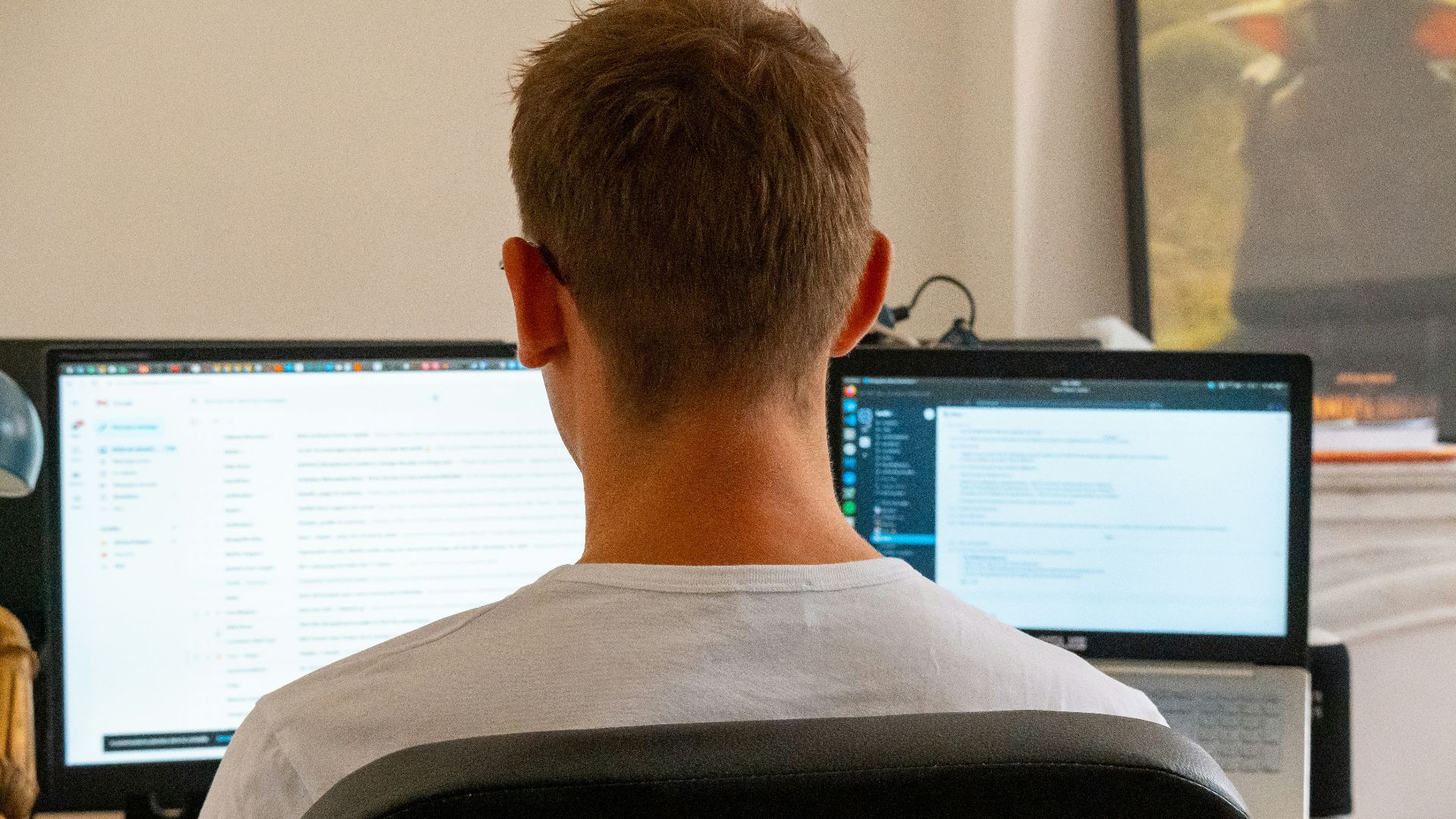 a man sitting in front of a computer