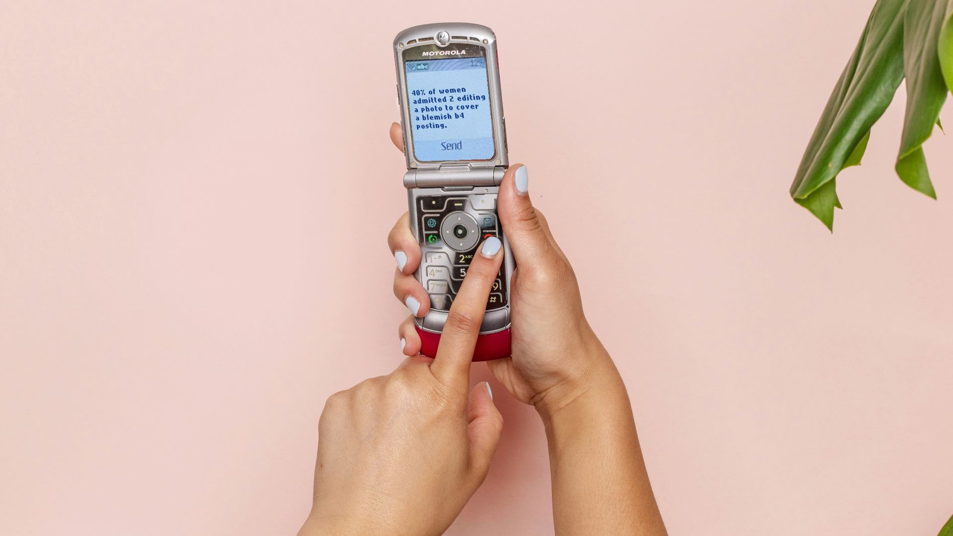 turned-on silver flip phone