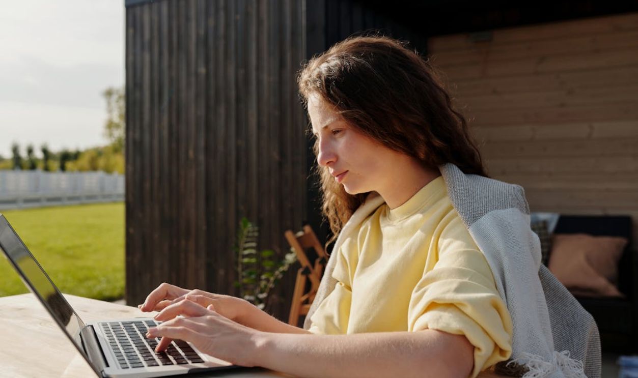 A Woman Sitting at the Table