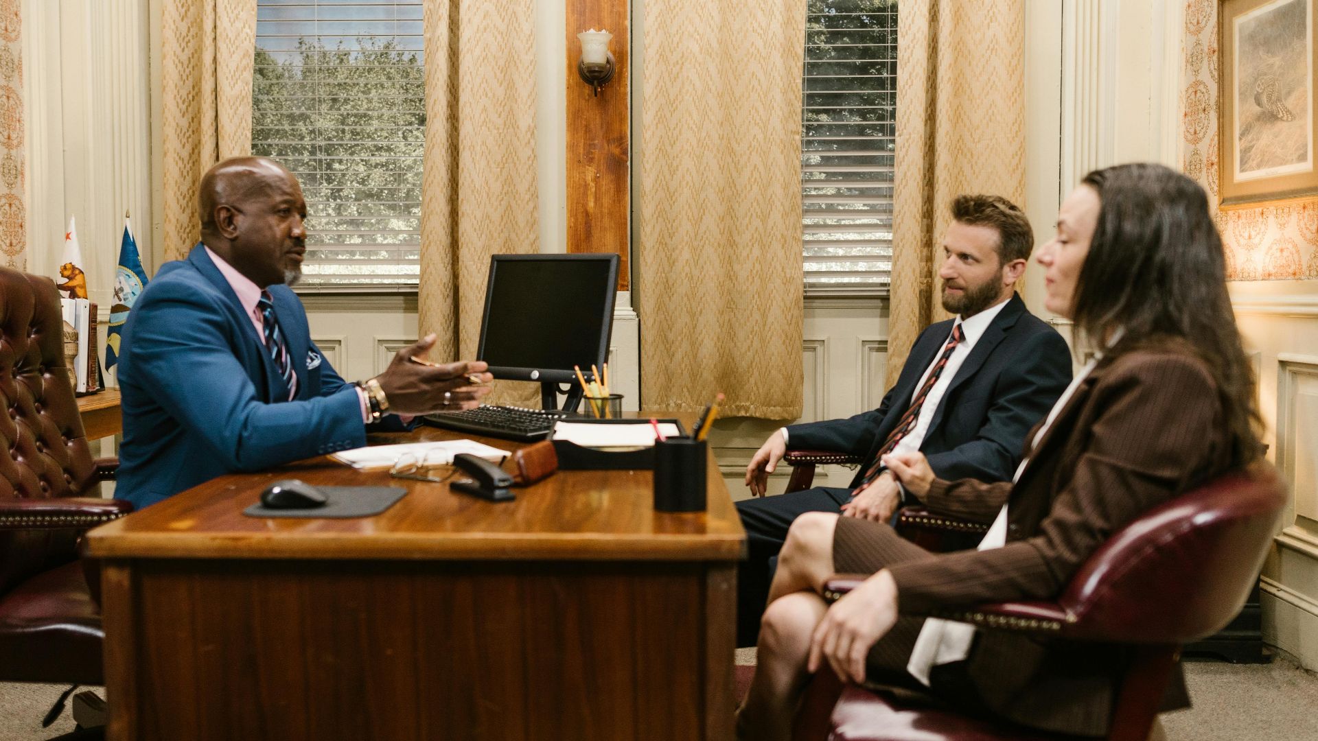Lawyers discussing with a client in a professional office environment. Business meeting concept.