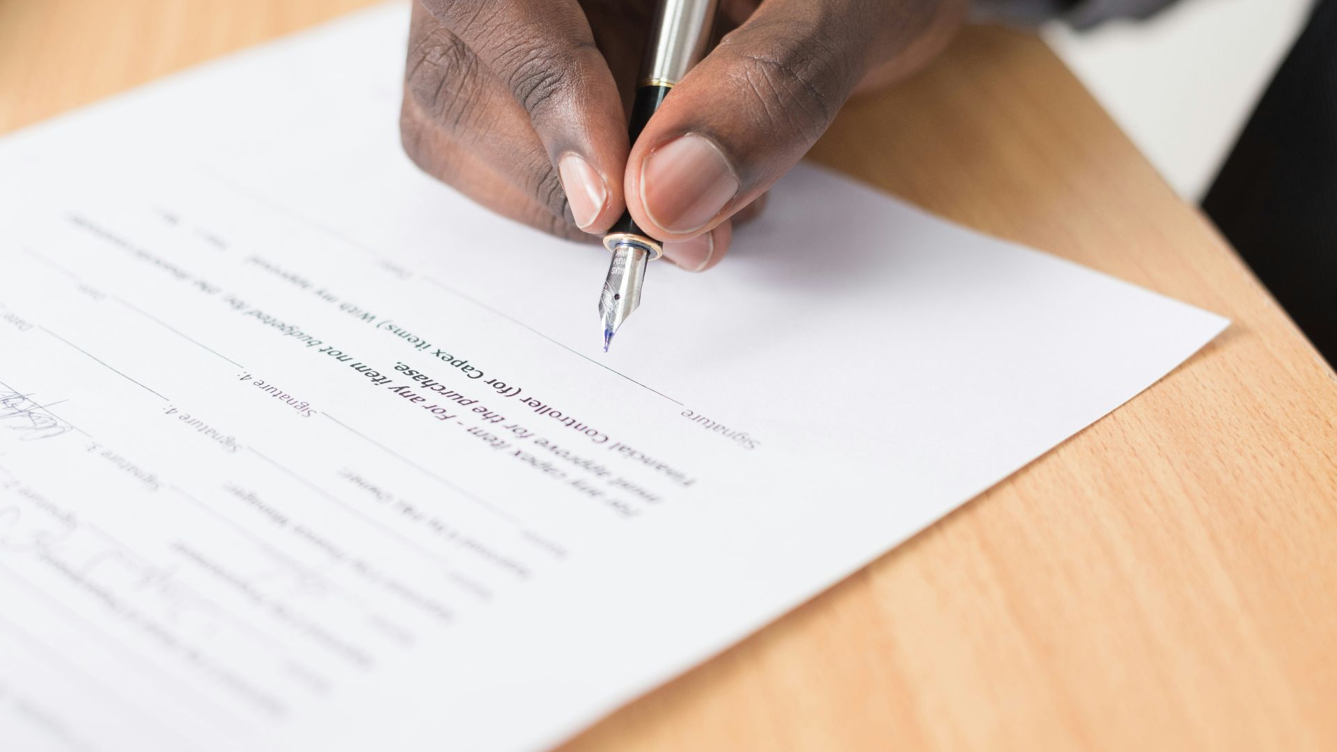 person writing on white paper