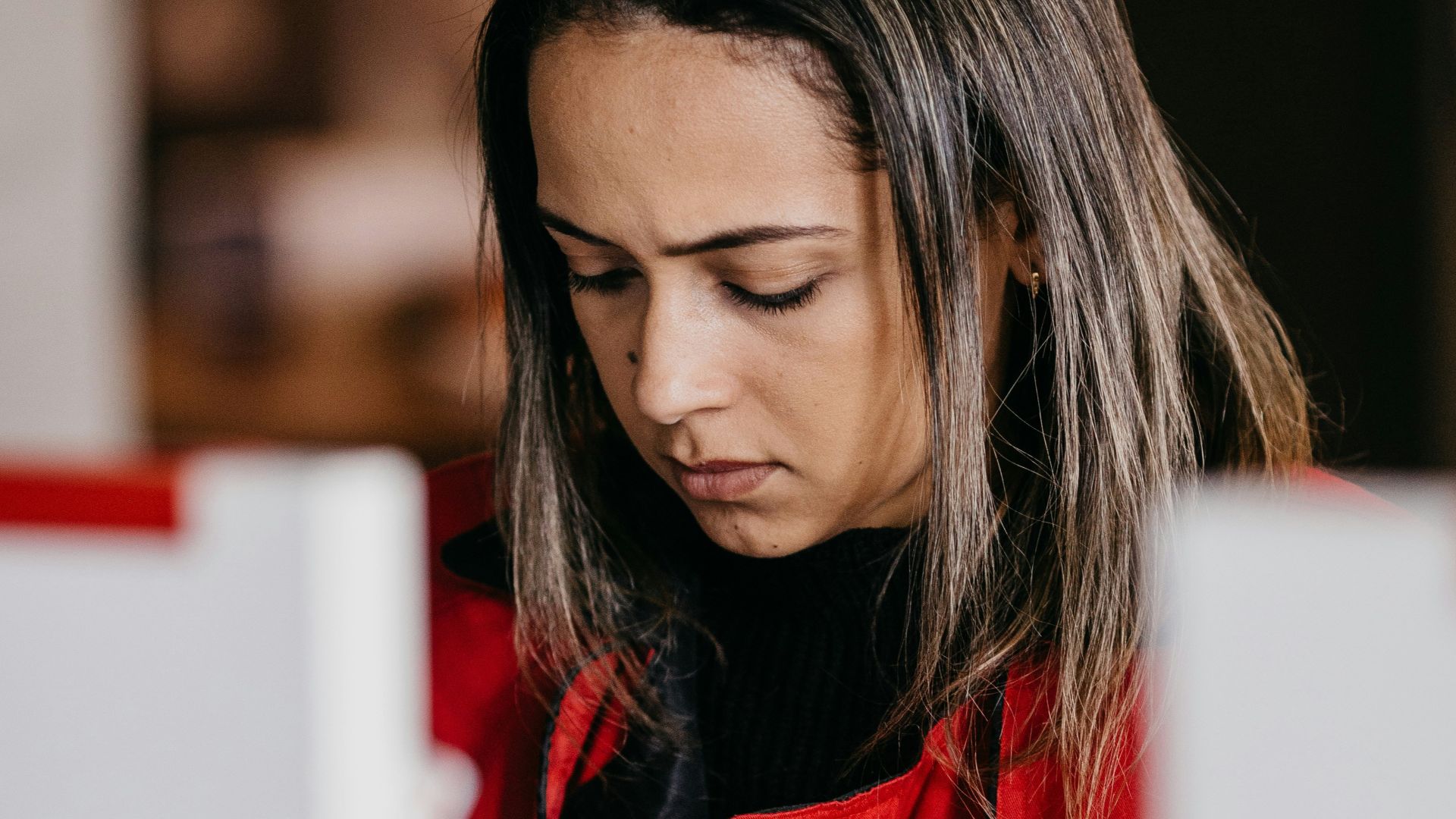 a woman looking at a computer screen