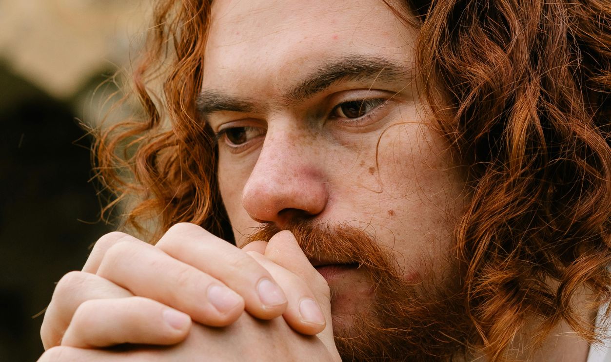 Bearded Man Praying with His Hands Clasped