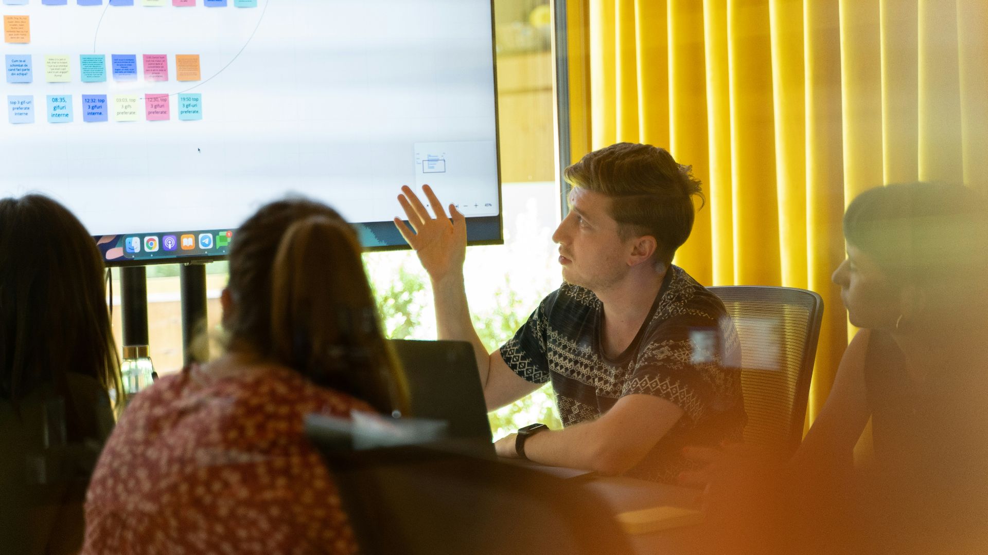 a man giving a presentation to a group of people