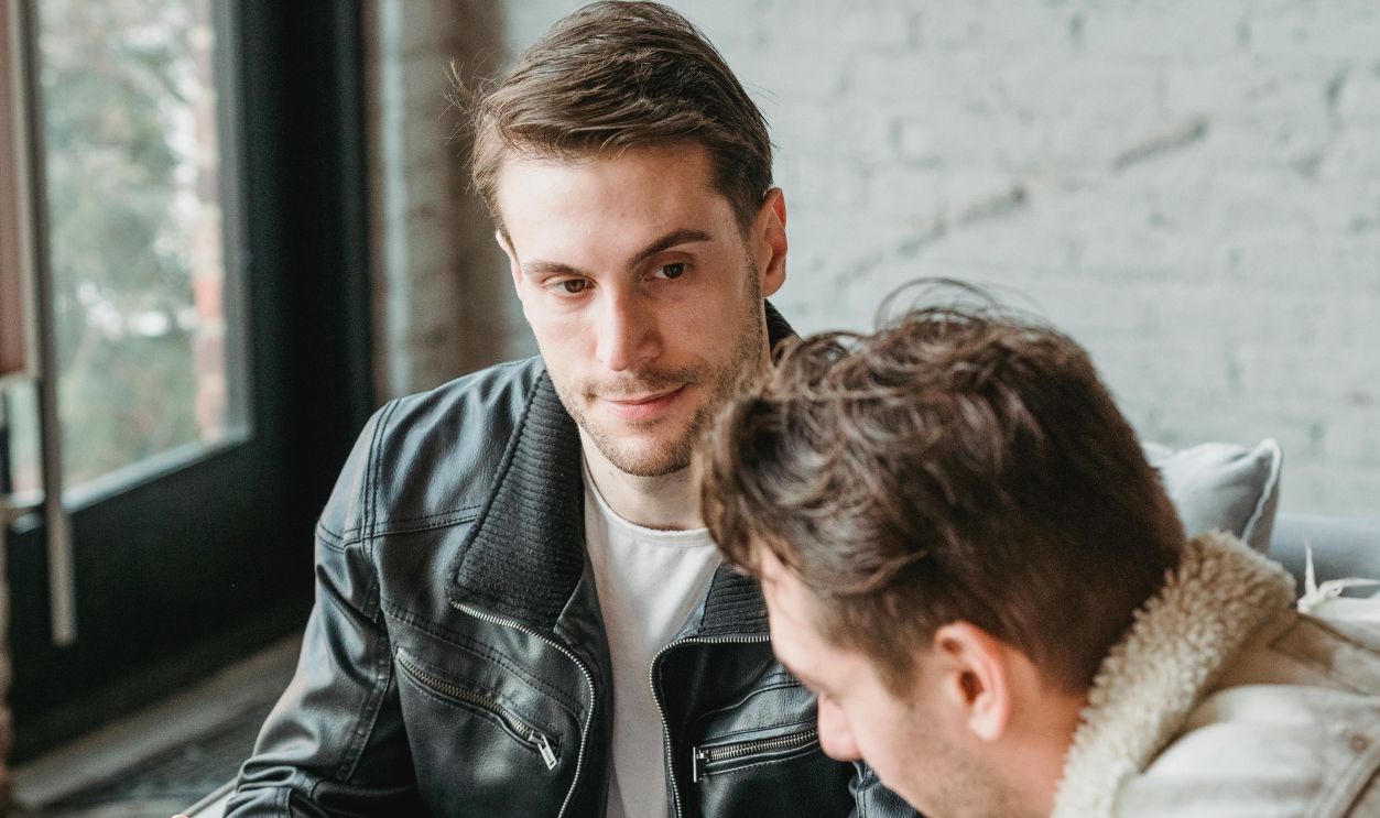 Coworkers drinking coffee while working