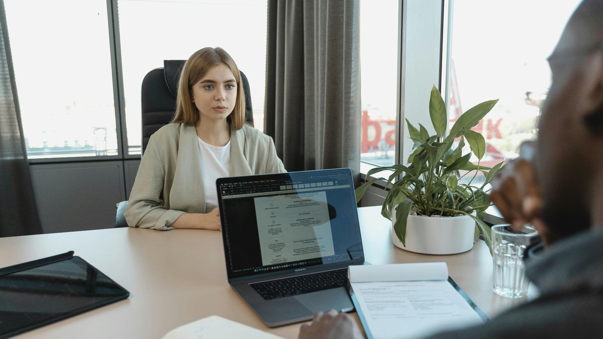 A professional job interview scene in a modern office setting, emphasizing recruitment and career opportunities.