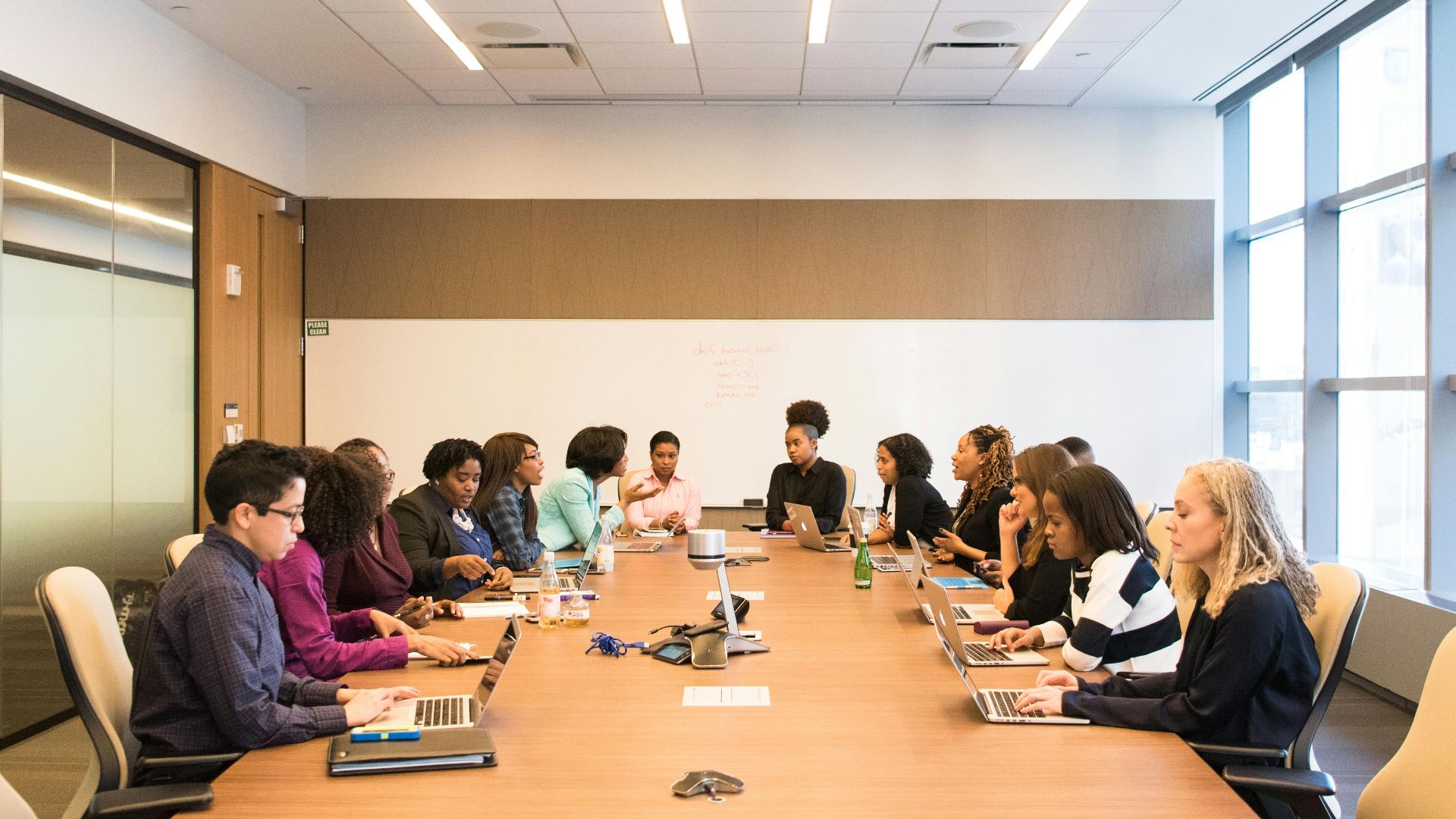 A multicultural team brainstorming and collaborating during a business meeting.