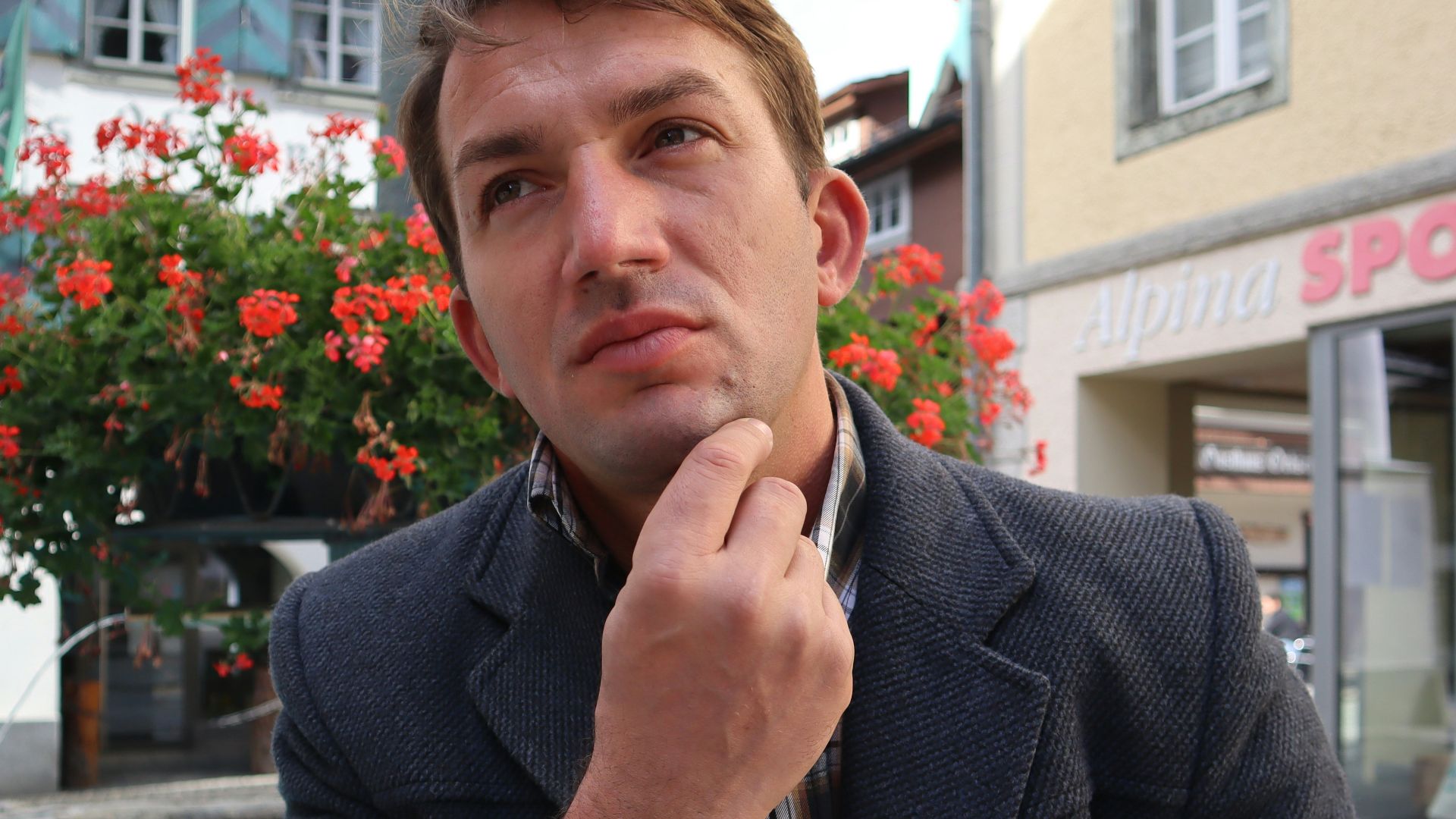 a man sitting in front of a pool of water