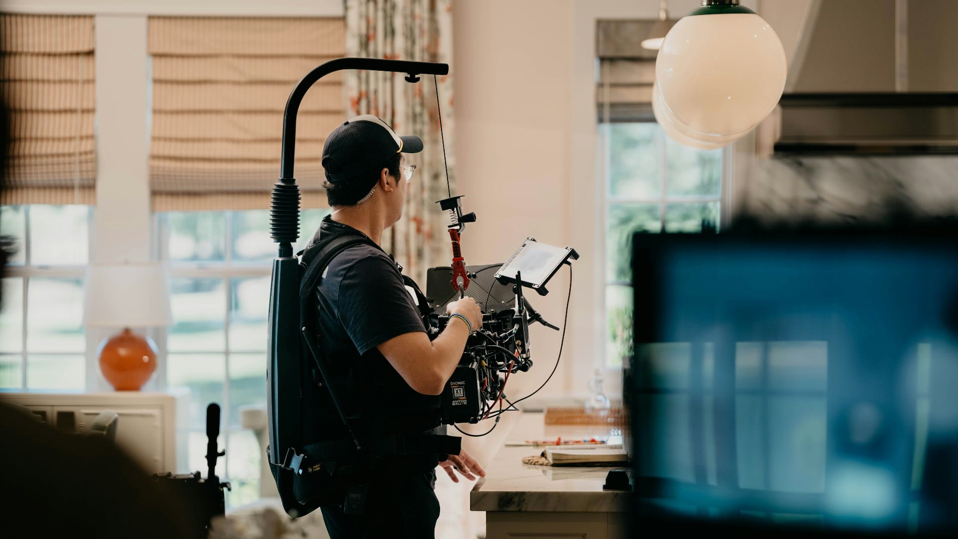a man with a camera in a room